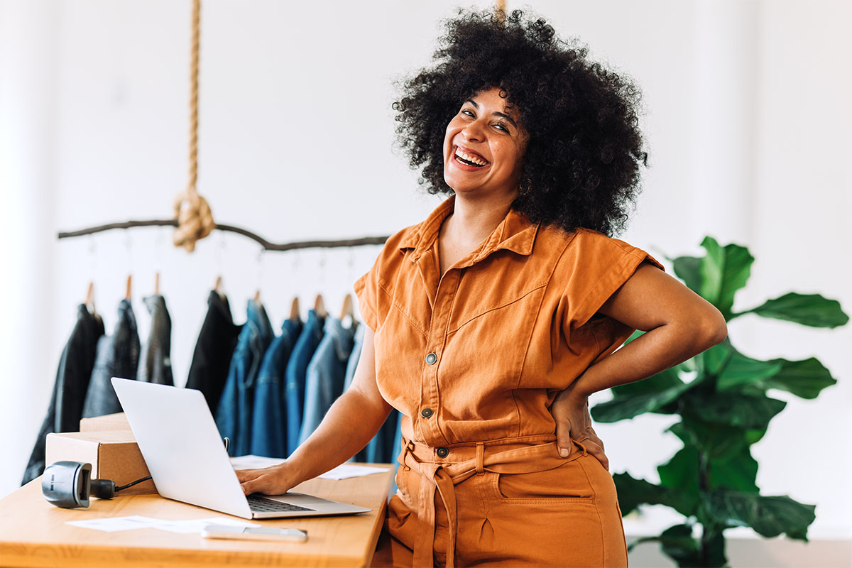 Business owner smiling at the camera in her shop